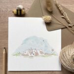 A greeting card with a mummy & baby bunny