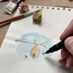 A new home card being illustrated by an artist