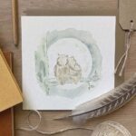 A greeting card with two owls