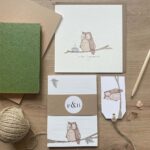 A set of stationery featuring an owl greeting card, notepad & gift tag