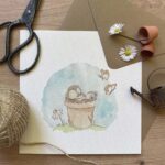 A greeting card with a hedgehog in a flower pot