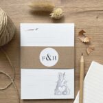 A lined notepad with a rabbit design