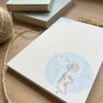 A lined notepad with mouse design
