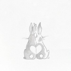 Two love bunnies with a heart