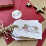 A Christmas card with a sticker & cat gift tags