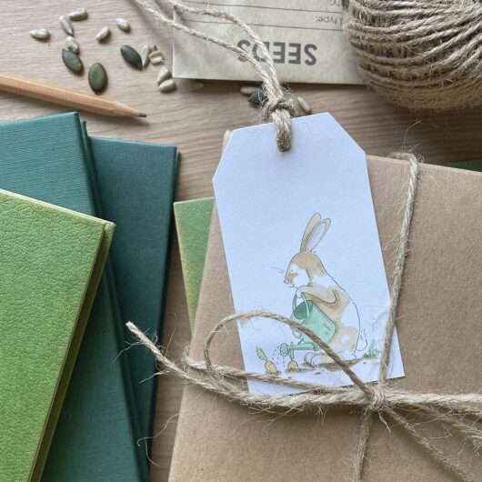 A hand drawn gardening bunny rabbit gift tag