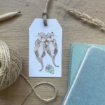 A tag for gift wrapping with a cute otter design