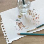An artists painting of a mouse and a sunflower for a thank you card