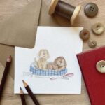 A cute greetings card with two cockapoo dogs
