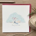 A Christmas card with a cute bunny rabbit design