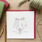A Christmas card with two festive felines