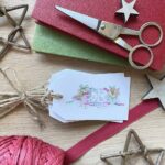A set of recycled paper Christmas gift tags