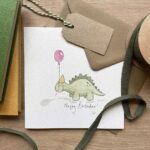 A dinosaur birthday card with a stegosaurus