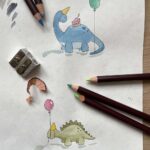 An artist illustrating dinosaurs for children's greetings cards