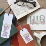 Stationery with a cat design showing a greeting card, bookmark & gift tag