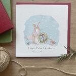 An illustrated Christmas card with a cute rabbit & robin