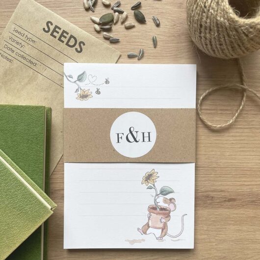 A paper notepad with a cute sunflower mouse design