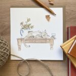 A greeting card with a cat design