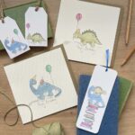 A range of children's stationery with a dino design
